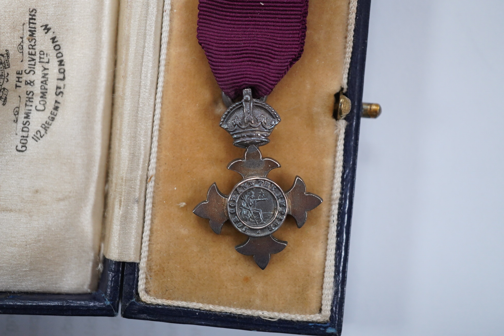 A cased George V military MBE containing leaflet with instructions as to wearing Insignia, together with the separately cased miniature. Condition - fair to good